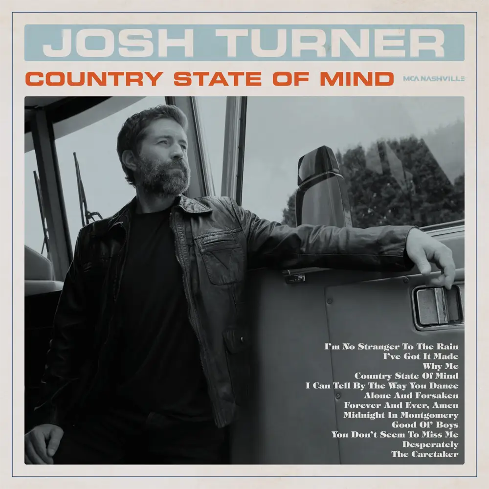 Album cover for ’Country State of Mind’ by Josh Turner, featuring a black and white photograph of a man looking out a vehicle window.
