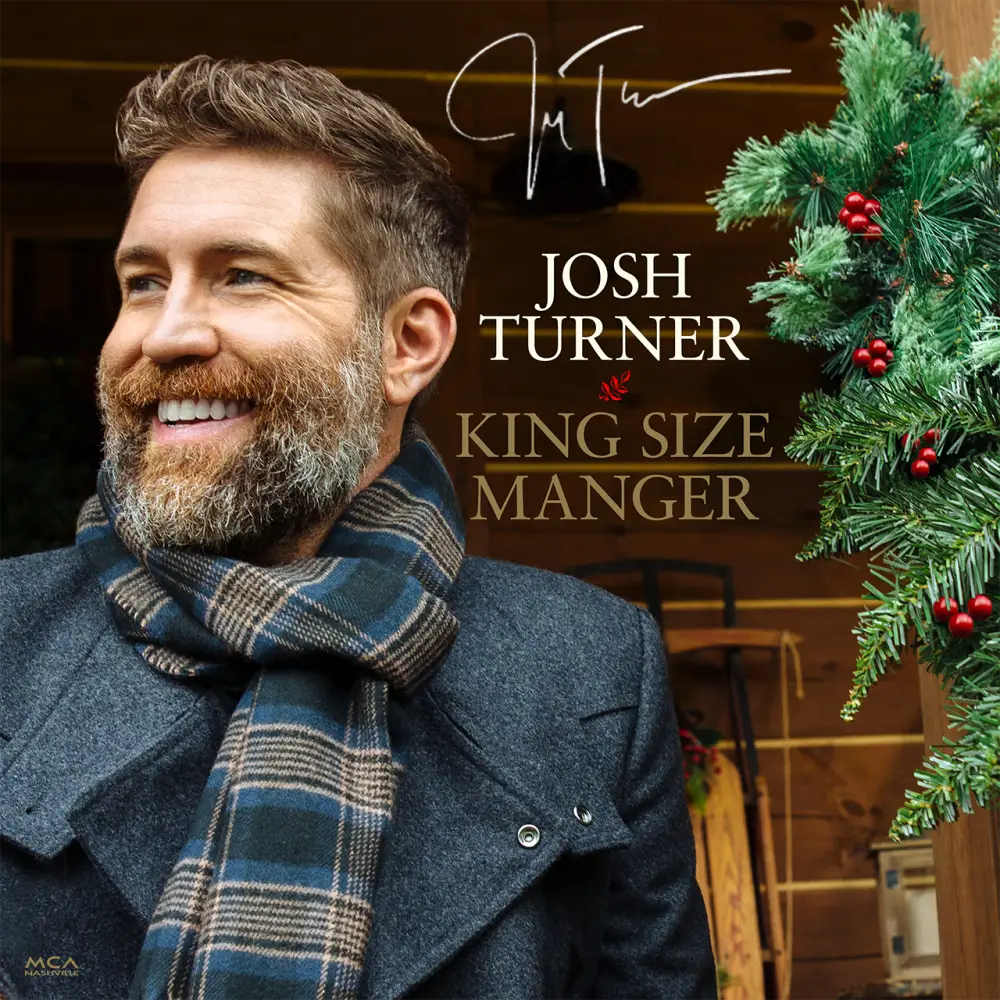Josh turner wearing a dark blue and beige plaid scarf.