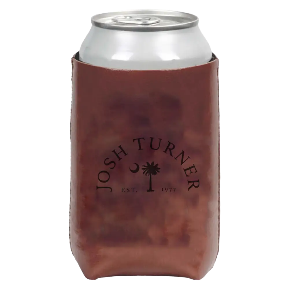 Beverage can inside a brown leather koozie with ’Josh Turner’ and a palm tree logo printed on it.