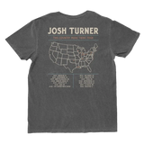 Dark gray cotton t-shirt featuring a white outline map of the united states with tour dates and locations printed below.