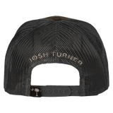 Black mesh trucker-style cap with ’Josh Turner’ embroidered on the back strap.