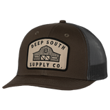 Trucker-style baseball cap with a ’Deep South Supply Co.’ patch on the front.