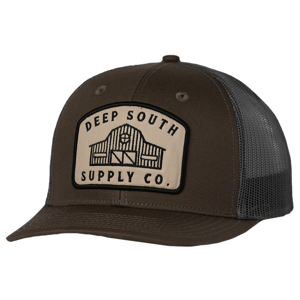 Trucker-style baseball cap with a ’Deep South Supply Co.’ patch on the front.