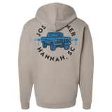 Light gray hooded sweatshirt with a blue truck design and text on the back.