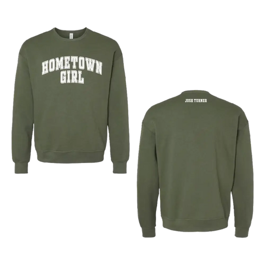 Olive green crewneck sweatshirt with ’hometown girl’ in white arched lettering across the chest and ’josh turner’ printed on the back neck.