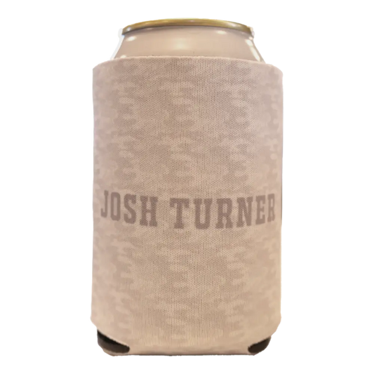 Beige knit can cooler with ’josh turner’ printed in muted gray lettering.