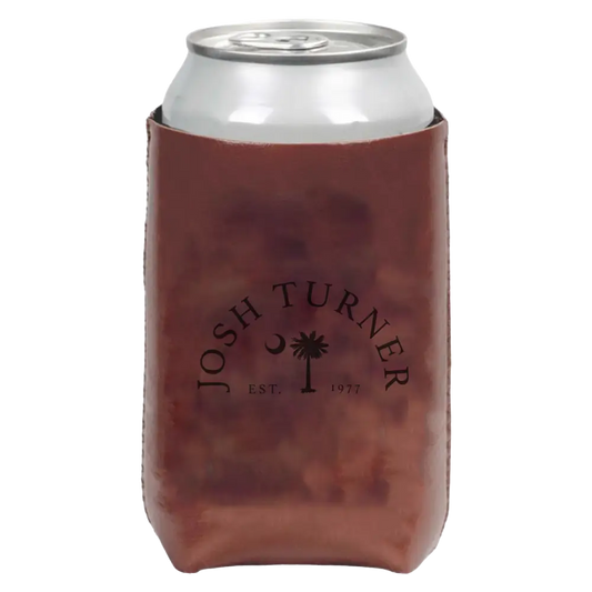 Beverage can inside a brown leather koozie with ’Josh Turner’ and a palm tree logo printed on it.
