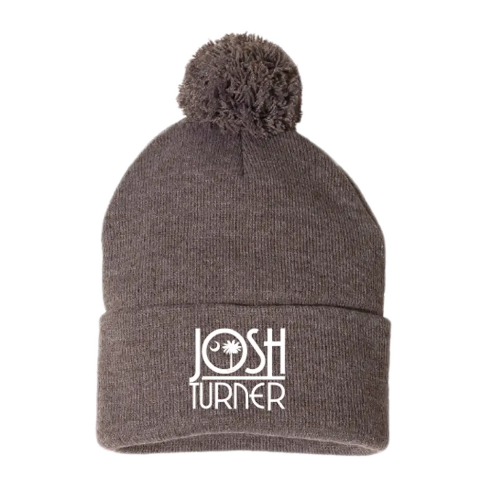 Gray knit beanie with a pom-pom and ’JOSH TURNER’ embroidered on the cuff.
