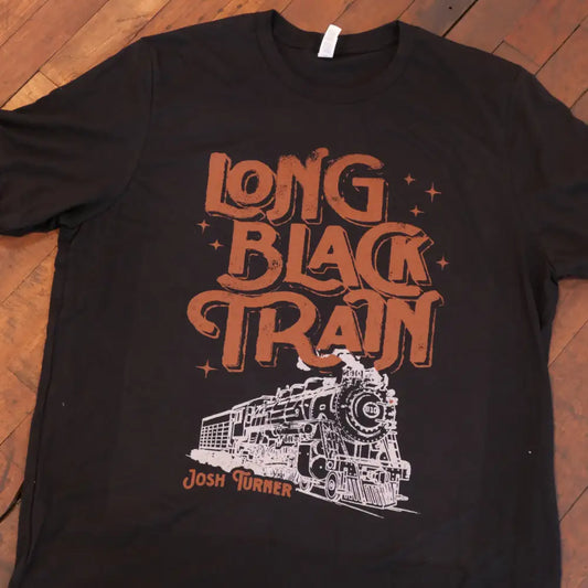 Black cotton t-shirt featuring a bold orange and white graphic of a steam locomotive with the text ’long black train’ above it, signed by josh turner.