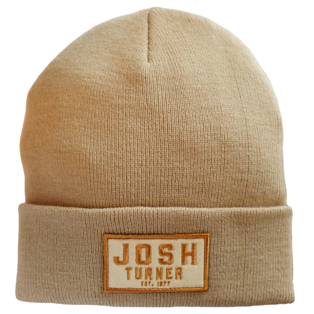 Beige knit beanie with a ’Josh Turner’ patch on the folded brim.