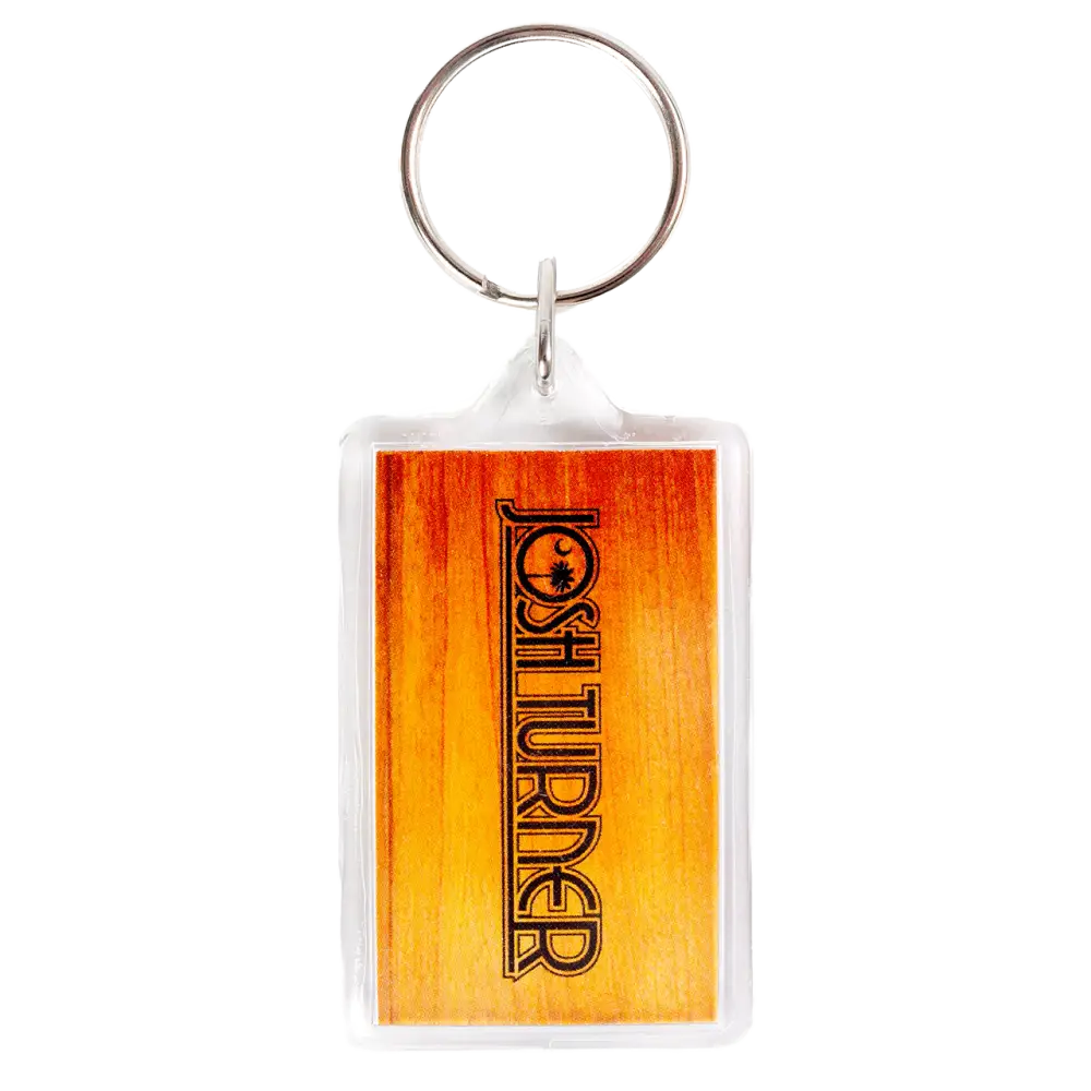 Keychain with a rectangular orange-tinted plastic tag displaying the word ’FORETURNER’.