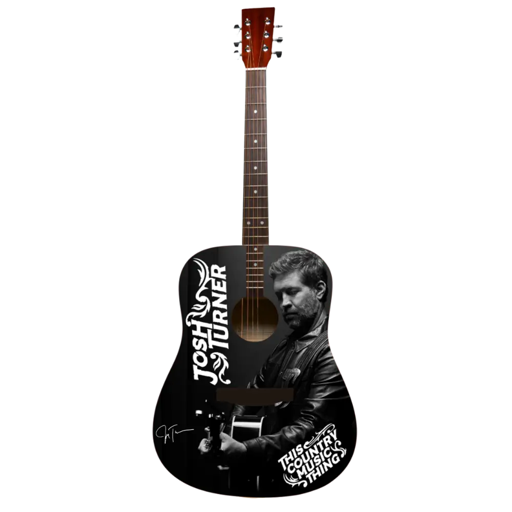 Black acoustic guitar featuring a black-and-white portrait of josh turner and his name in stylized white lettering, with the phrase ’this country music thing’ printed below.