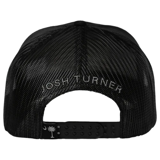 Black mesh trucker hat with ’josh turner’ embroidered in white thread across the back and a small white palm tree logo on the adjustable strap.