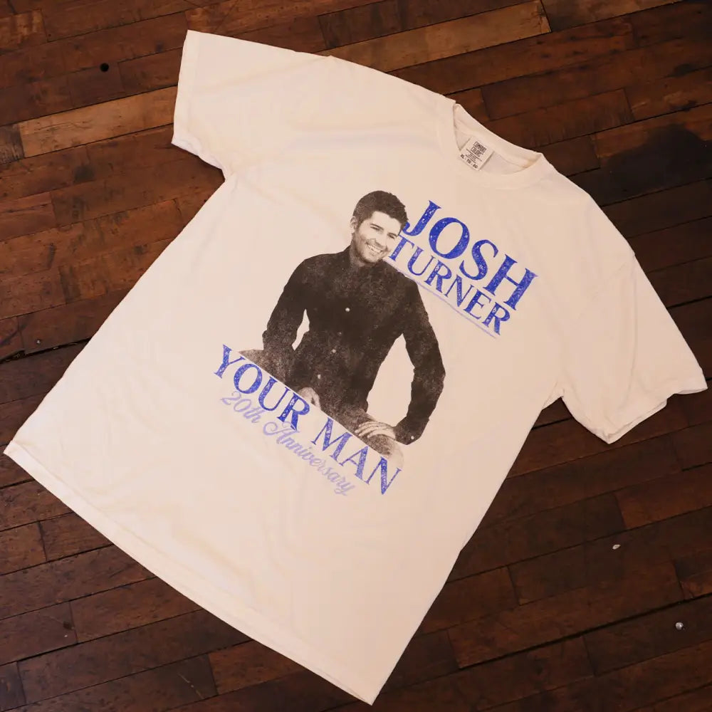 Off-white cotton t-shirt featuring a black-and-blue graphic of josh turner with the text ’josh turner’ and ’your man 20th anniversary.’