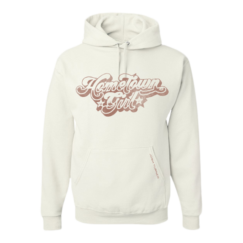 White hoodie sweatshirt with ’Hometown Girl’ text in retro-style pink lettering on the front.