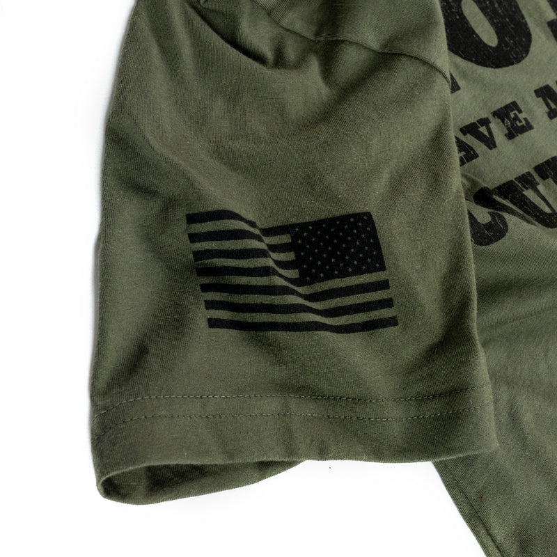 Olive green t-shirt sleeve with a black American flag patch.