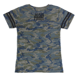 Camouflage-patterned t-shirt with ’JOSH TURNER’ printed on the chest.